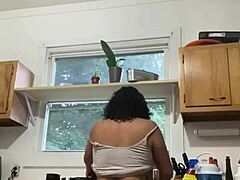 Latina mature woman enjoying household chores